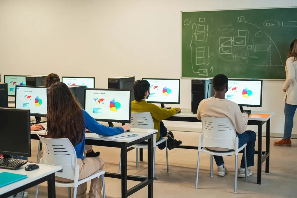 multiracial-students-using-computers-during-business